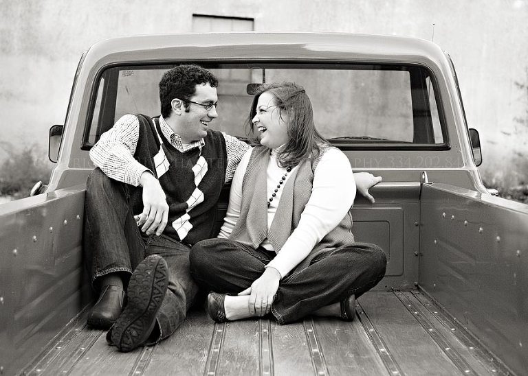 an engagement session with a dog and an old truck in downtown montgomery alabama