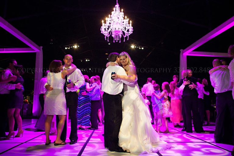 a chandelier topped dance floor at a union station train shed reception in montgomery alabama