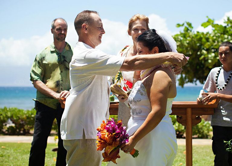 a lei exchange at a maui destination wedding in hawaii