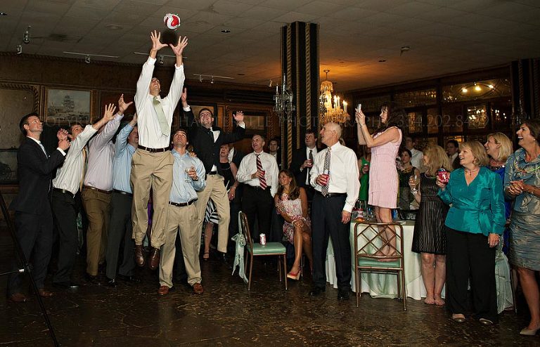 garter toss at a wedding reception at north river yacht club in tuscaloosa
