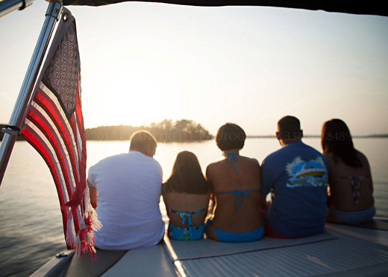 a family on a boat at lake martin