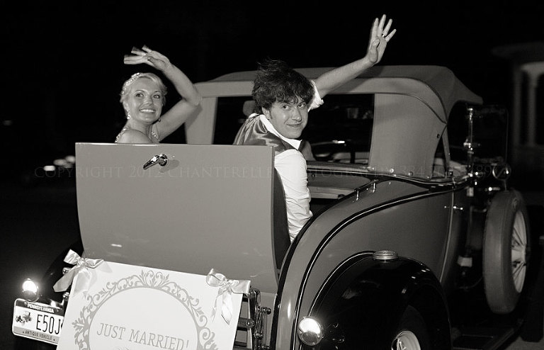 bride and groom leave in antique car from kiawah island golf resort