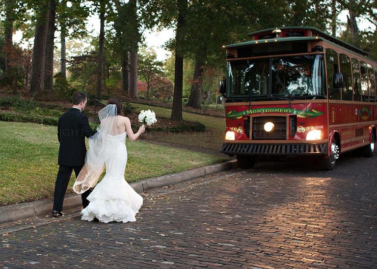 bride and groom board the trolley to the capital city club in montgomery