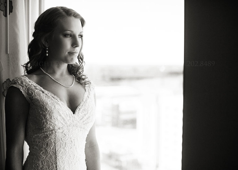 bride in the window at the renaissance montgomery hotel in alabama