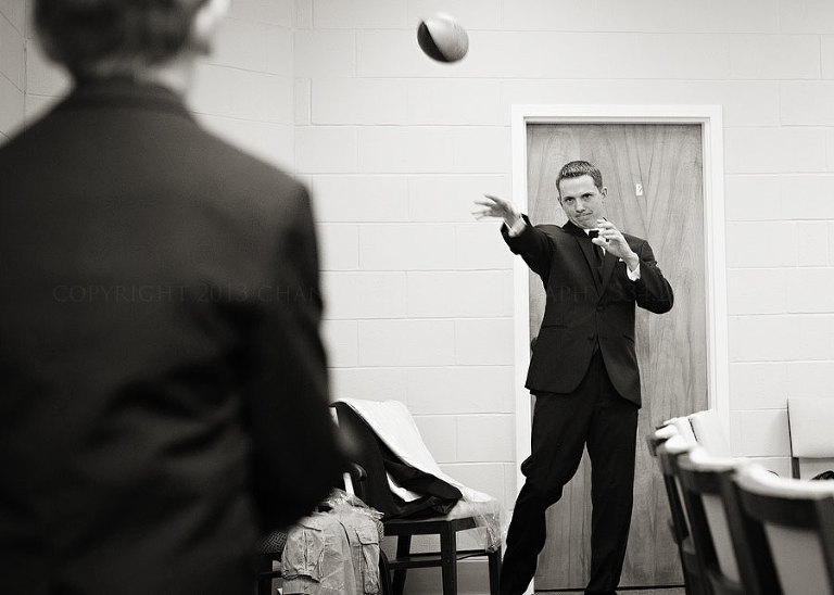 groomsmen tossing a football at first baptist church