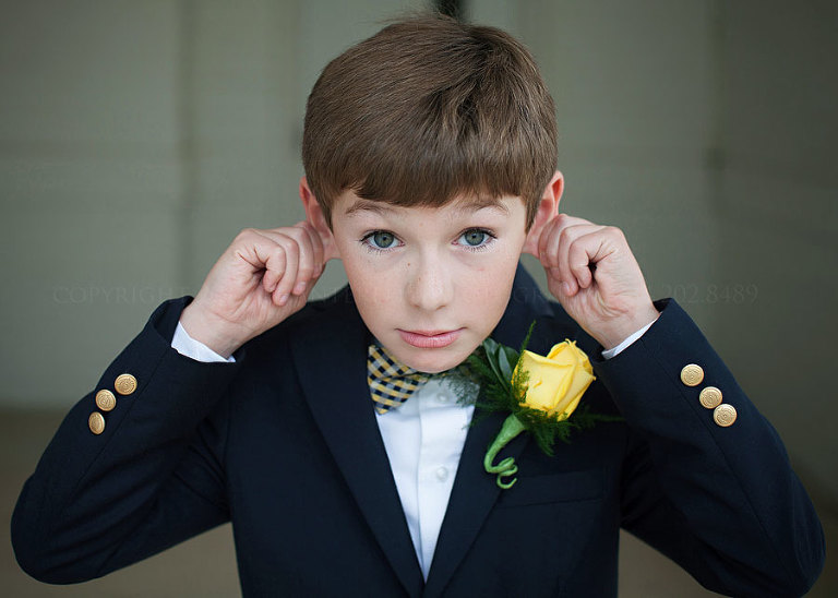 ringbearer in navy and yellow with a checked bowtie