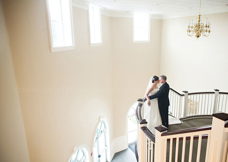 bride and groom portrait in first baptist church stairwell