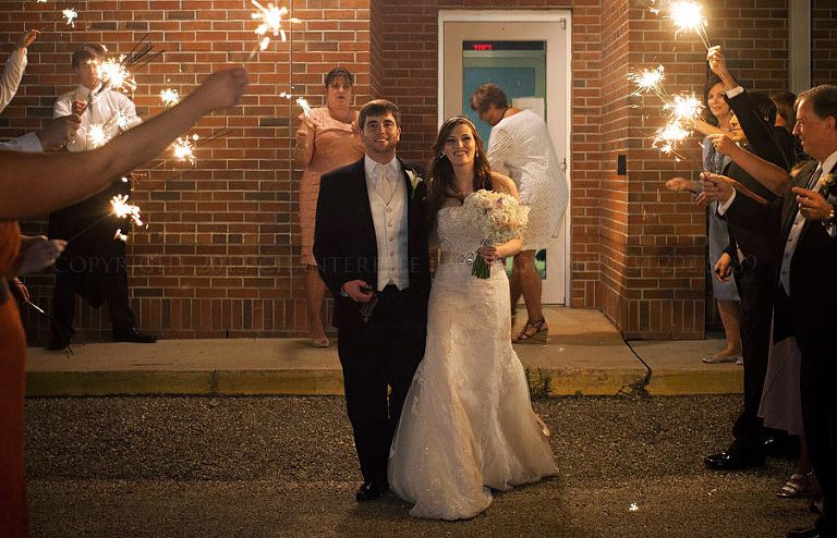 bride and groom sparkler exit from troy university wedding