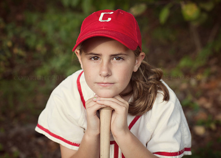 girl in a baseball outfit