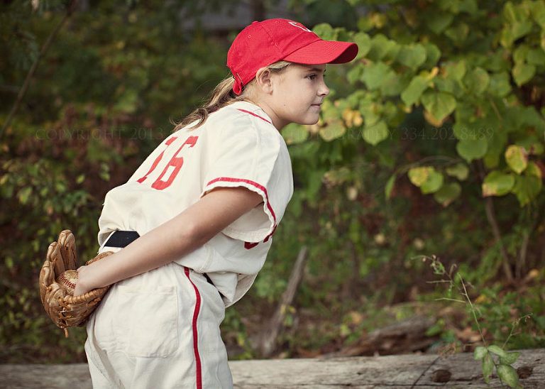 tomboy in a vintage baseball uniform