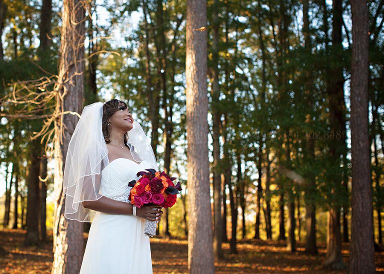 bride with falling leaves at an alabama wedding