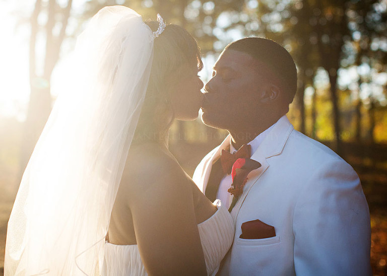 bride and groom kiss in alabama sunlight