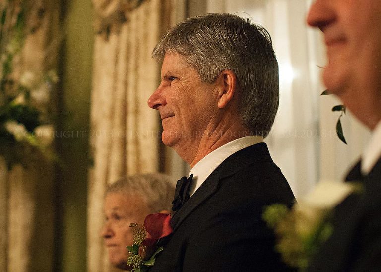 groom seeing his bride coming down the aisle in auburn
