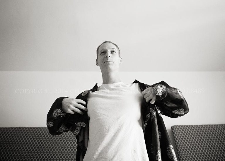 groom getting ready for vietnamese tea ceremony