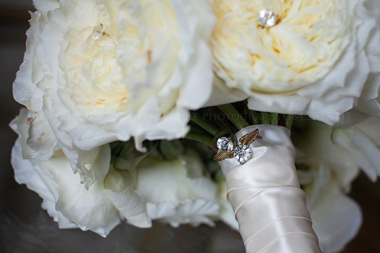 white bridal bouquet with grandfathers pin