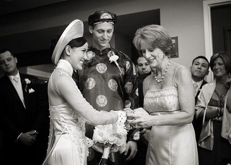 grooms mom giving gifts to bride at tea ceremony