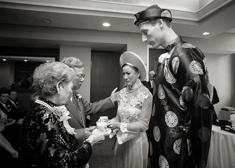 bride and groom offering tea to grandparents