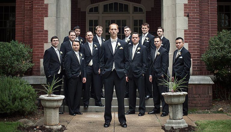 groom and groomsmen outside cathedral of saint paul
