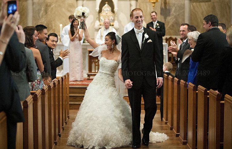 bride celebrating after cathedral of st paul ceremony
