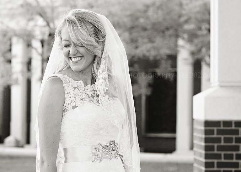 bride giggling in black and white