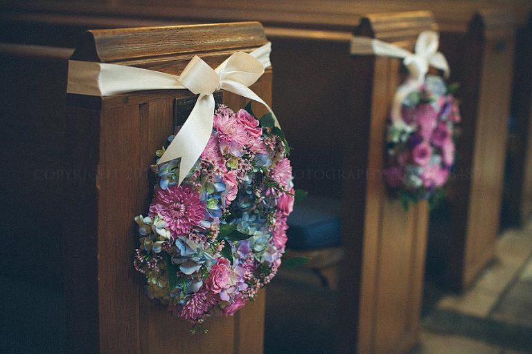 blue and purple wedding flowers pew wreaths