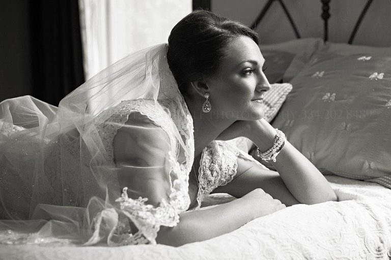 black and white bride on a bed
