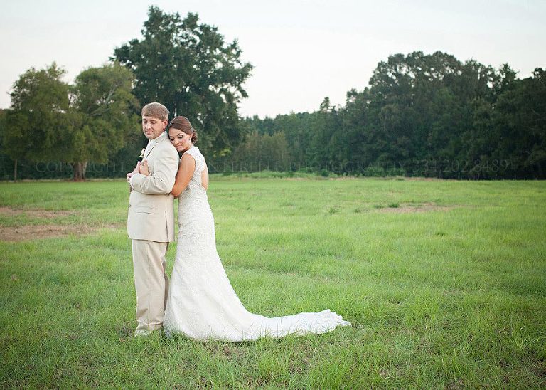 bride and groom in a field in prattville alabama