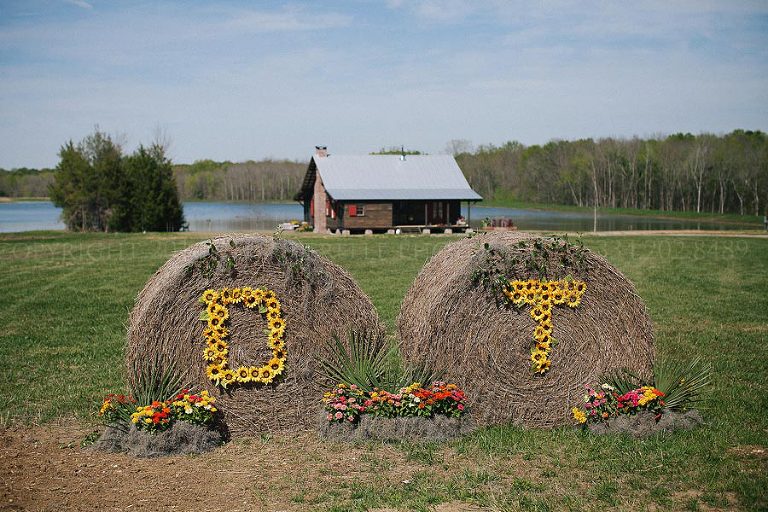 initials on hay bales at rustic alabama wedding