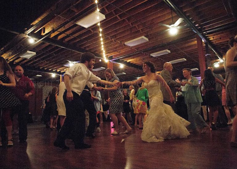 bride and groom swing dance at nashville wedding reception