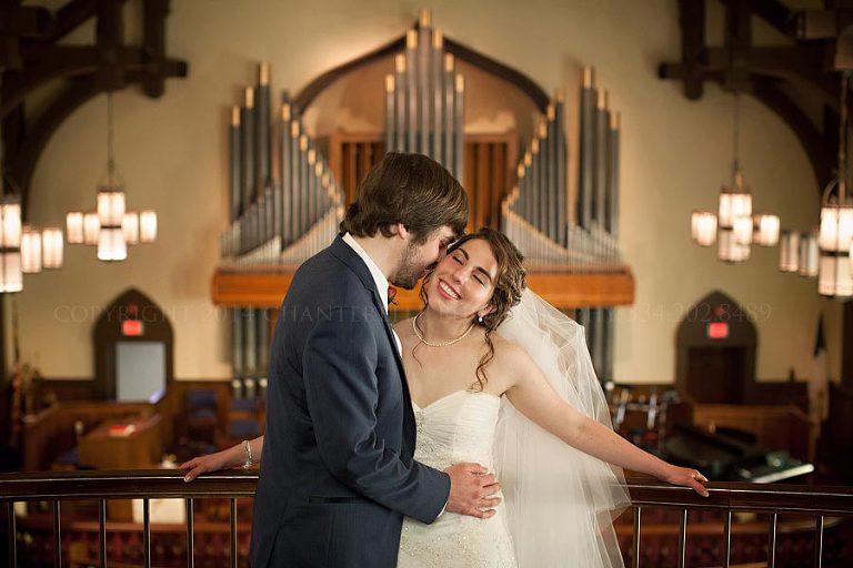 bride and groom in balcony at their nashville wedding