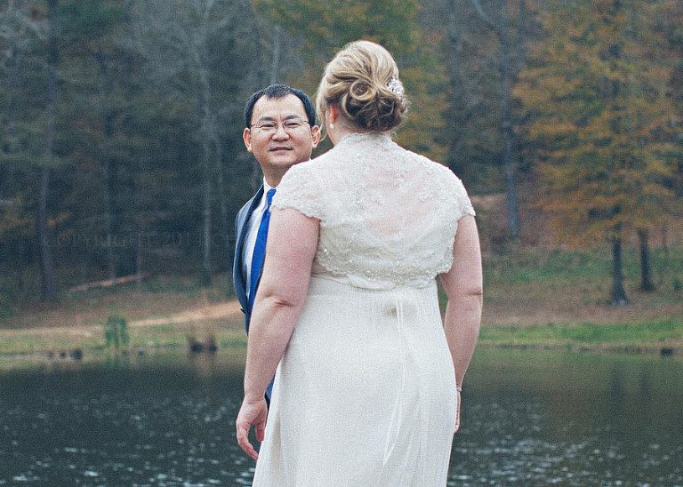 bride and groom first look at barn at pisgah hill