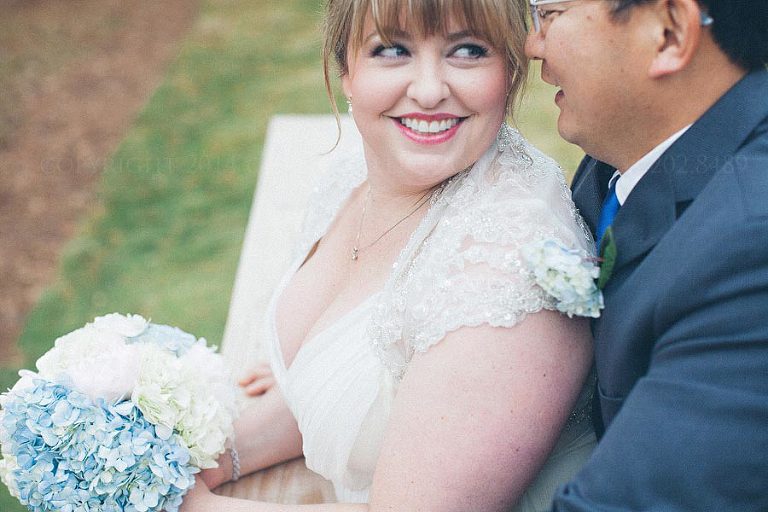 bride and groom at their blue and white wedding