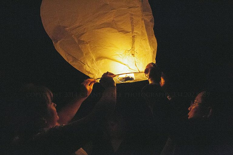 bride and groom releasing wish lantern