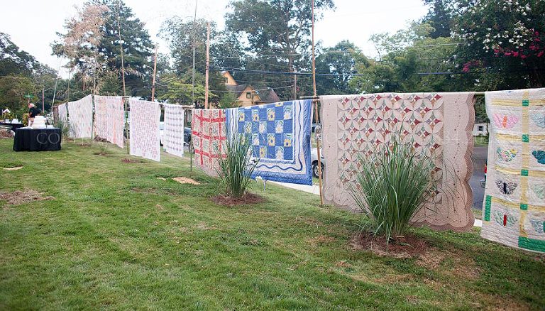 quilts hanging as a border and background at an alabama wedding