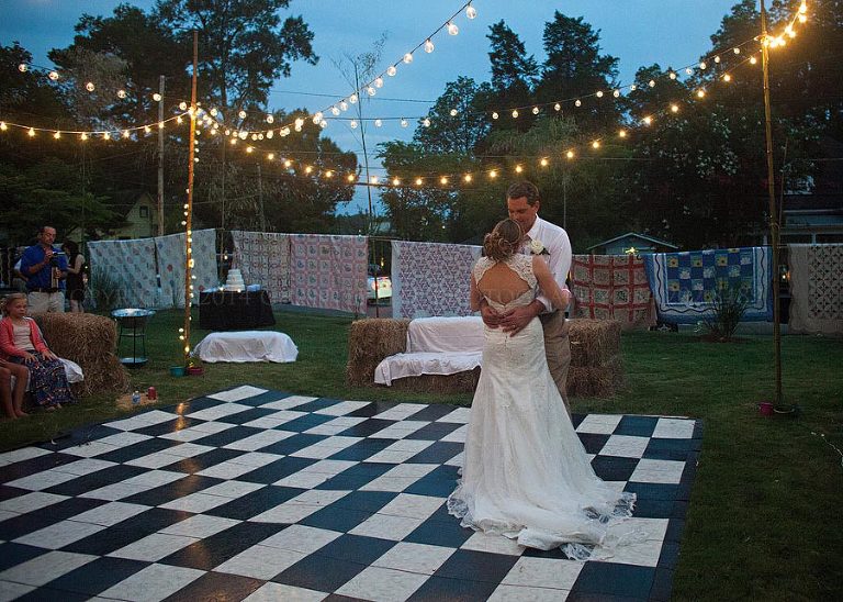 bride and groom first dance at an outdoor talladega wedding reception