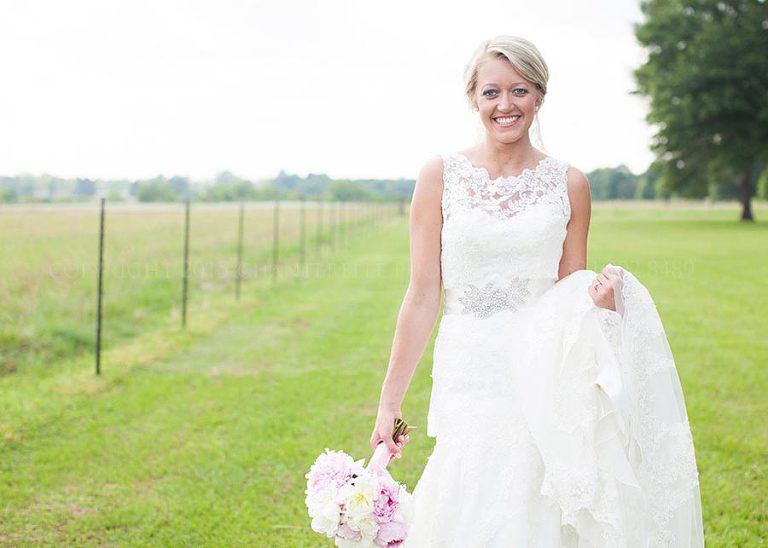 bride in lace wedding gown before alabama wedding