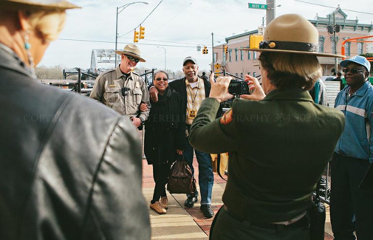 law enforcement and visitors taking pictures outside selma interpretive center