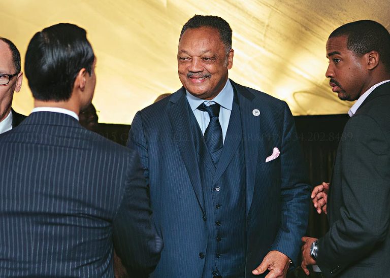 reverend jesse jackson shaking hands with secretary castro in selma