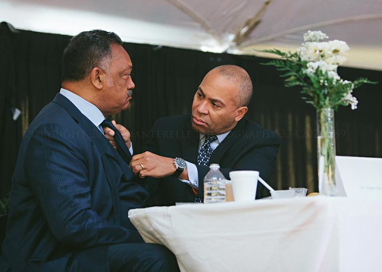 governor patrick fixes reverend jesse jacksons tie at king unity breakfast in selma