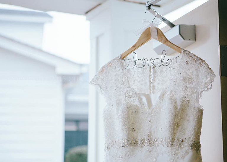 lace wedding gown with bride hanger