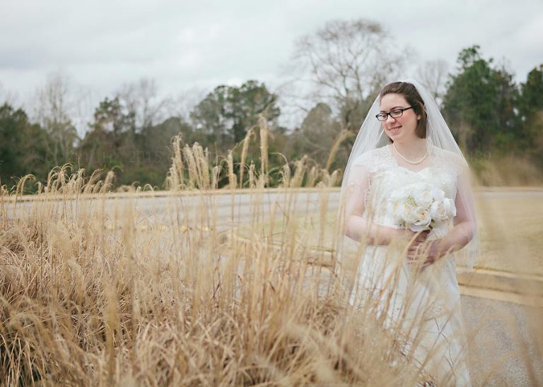 bride in yellow grassy field