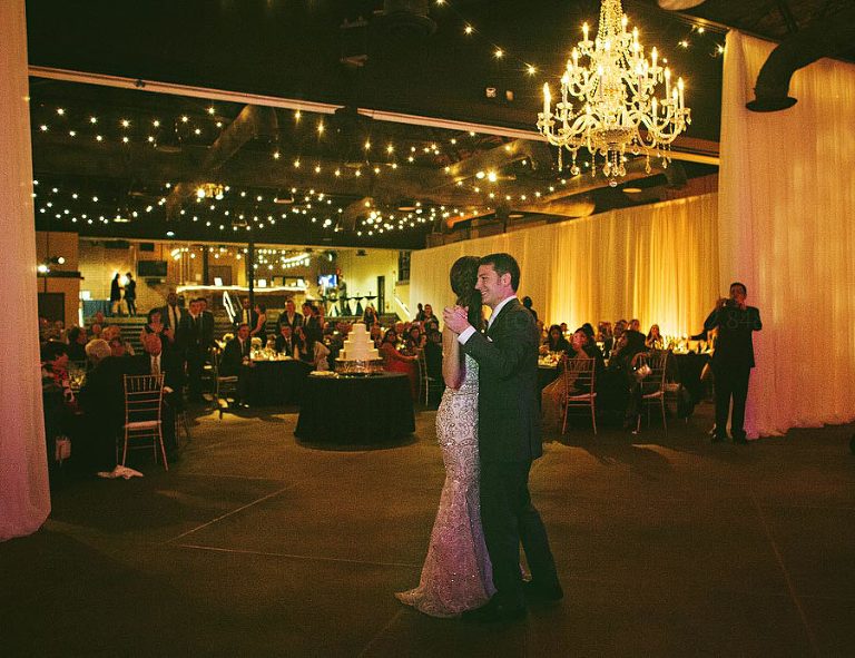 first dance with chandelier at bottling plant event center