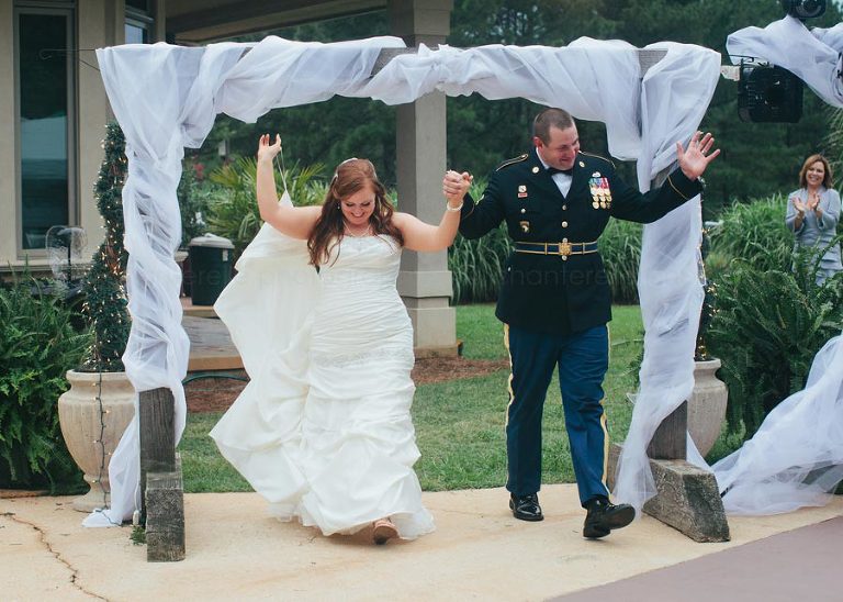 bride and groom enter alabama backyard wedding reception