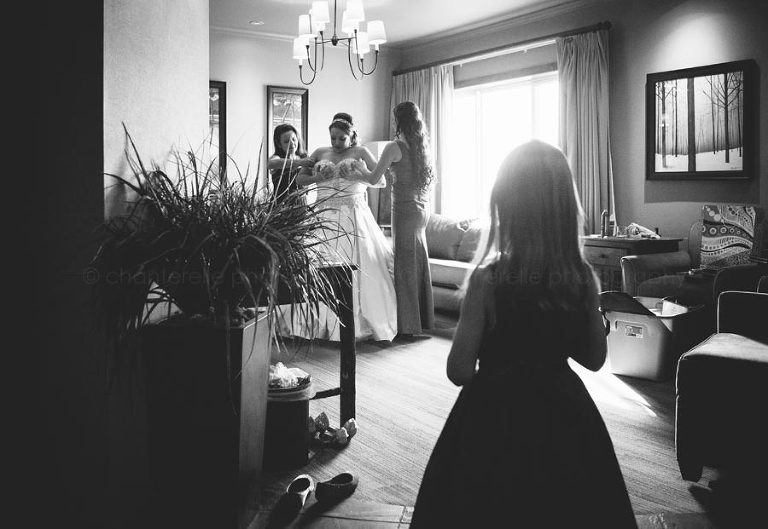 girl watching bride get ready at feather falls lodge