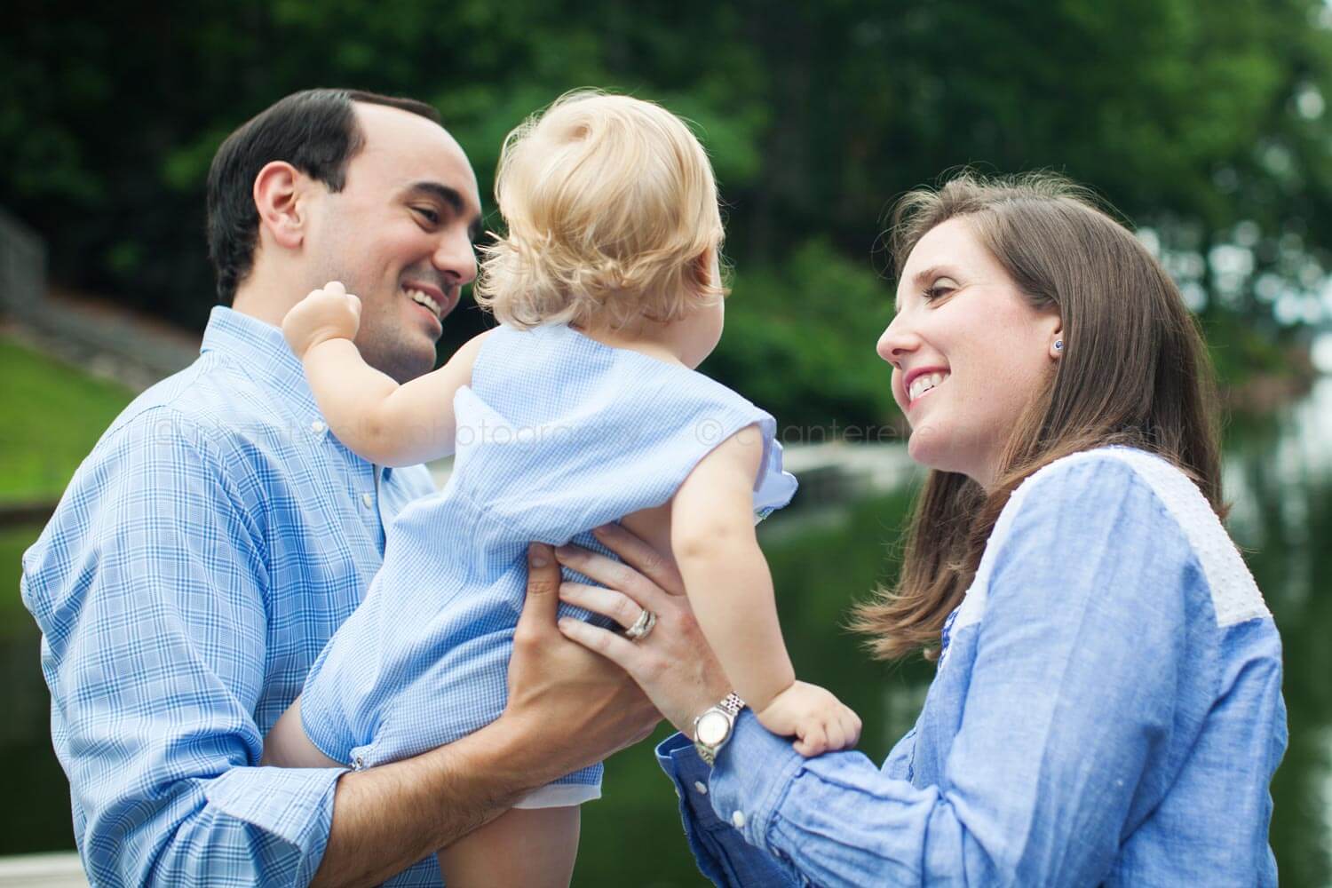 mom dad and baby at family portrait session