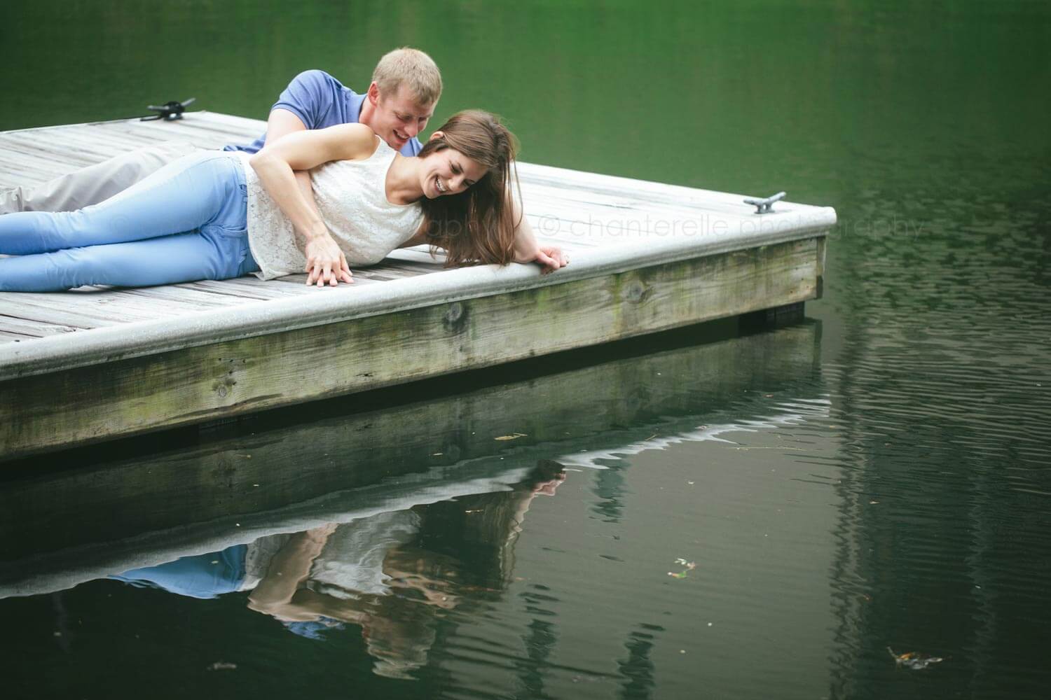 reflection portrait of couple at lake martin