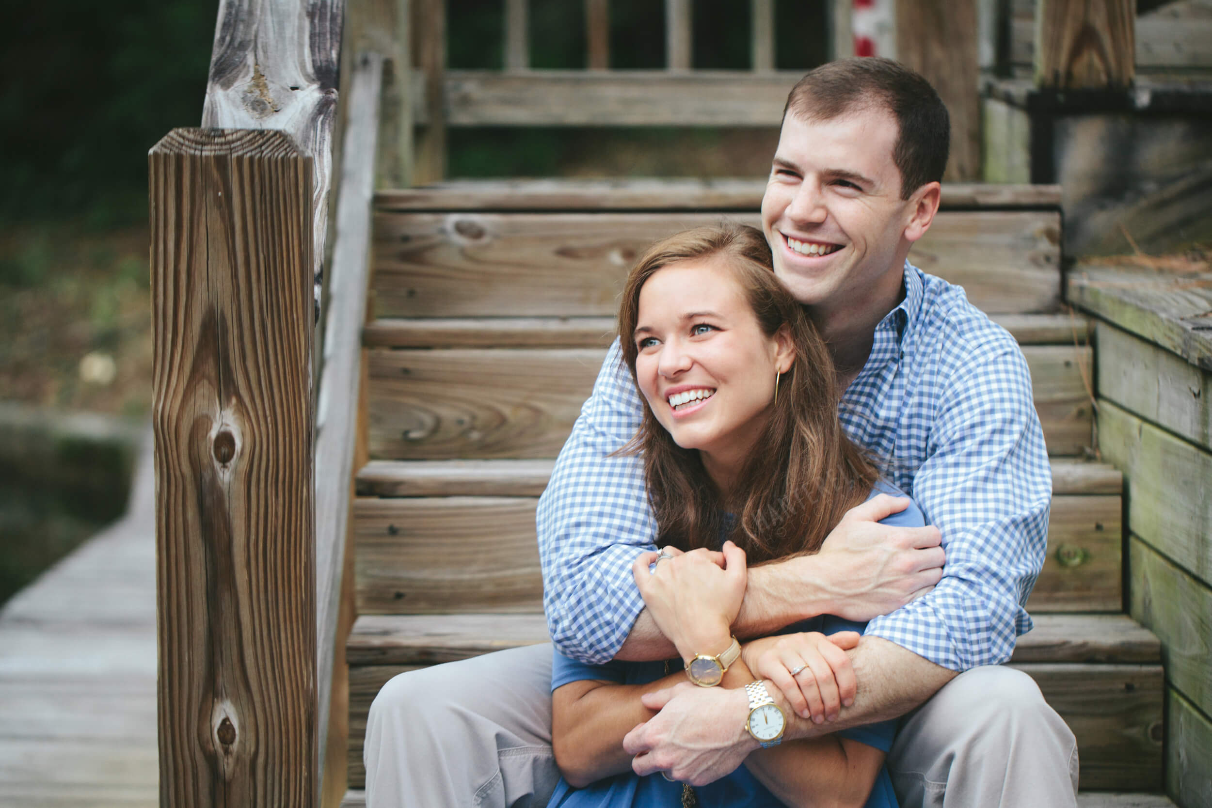 young couple on steps at lake martin house