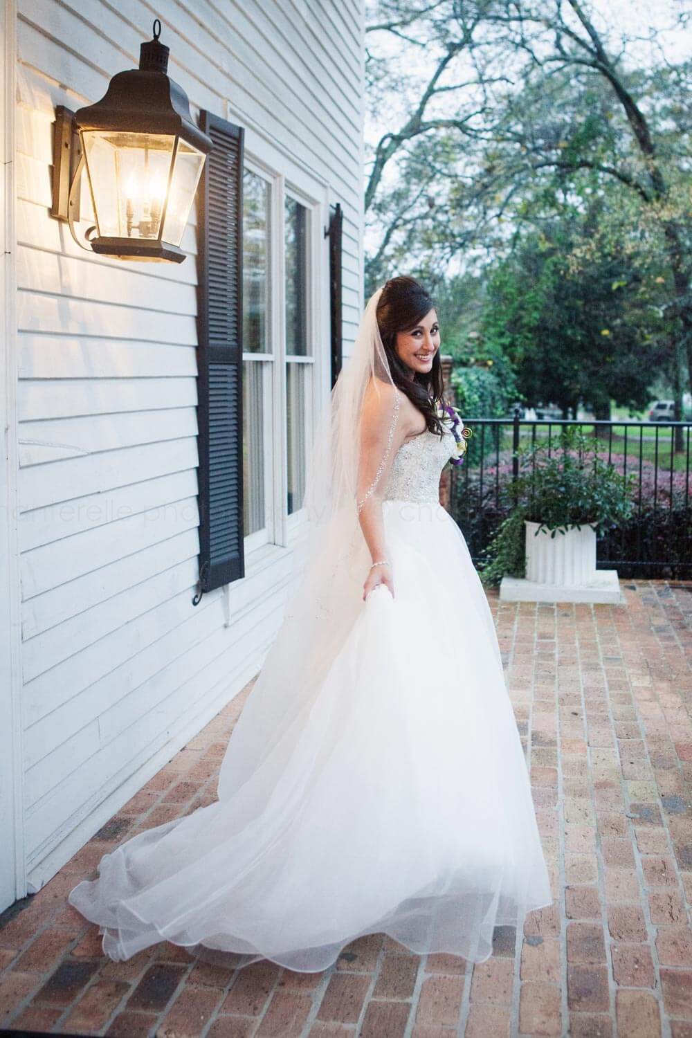 bride in sottero and midgley gown outside carl house