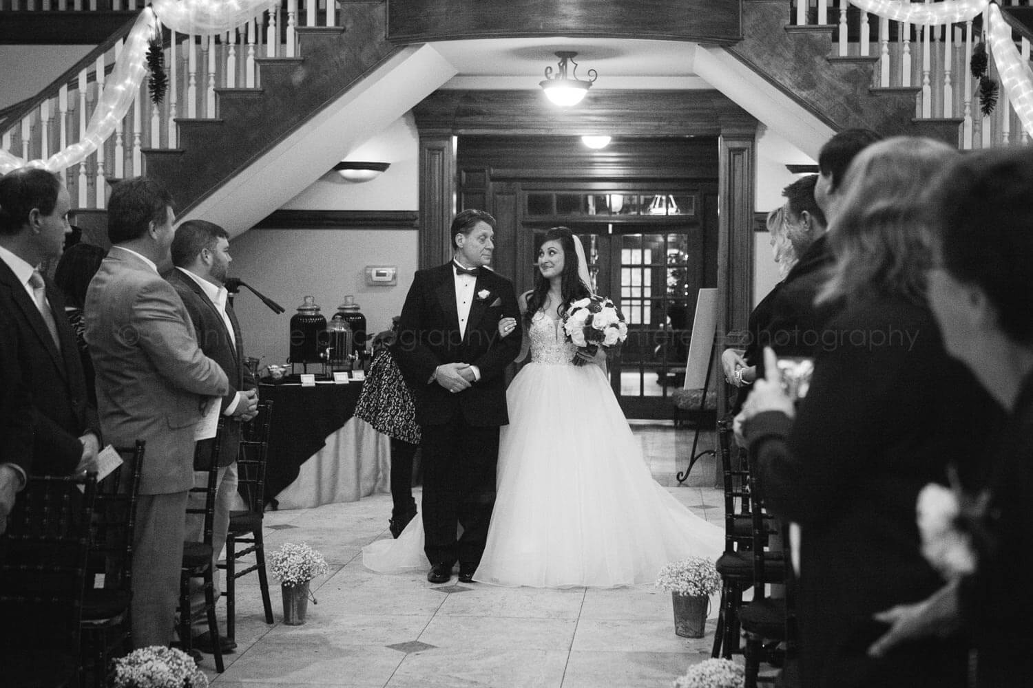 bride and father walking down the aisle at carl house wedding ceremony