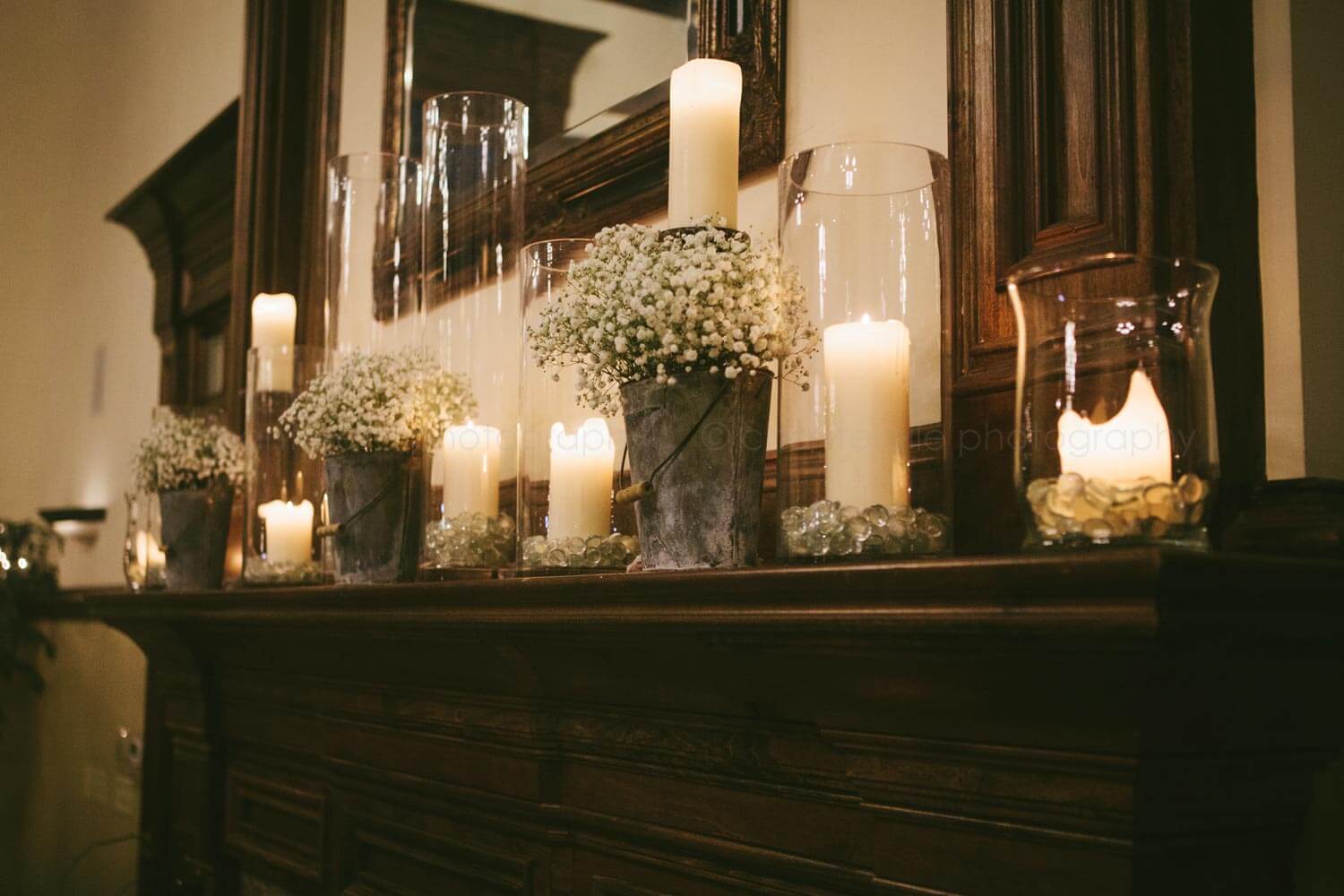 candles and baby's breath on carl house fireplace